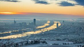 Vienna, Austria in Europe. Panoramic view to the city and the danube river from Kahlenberg hill to the snow covered city.