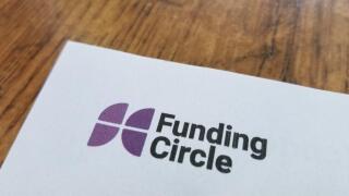 Close-up of logo for peer-to-peer lending company Funding Circle on paper, against a light wooden surface, April 21, 2019. ()