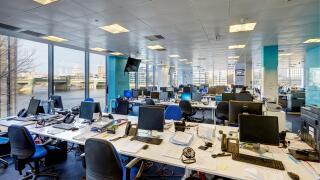 office desks terminals screen trading business city money empty trade exchange shares investment bank banking modern windows view london capital hedge