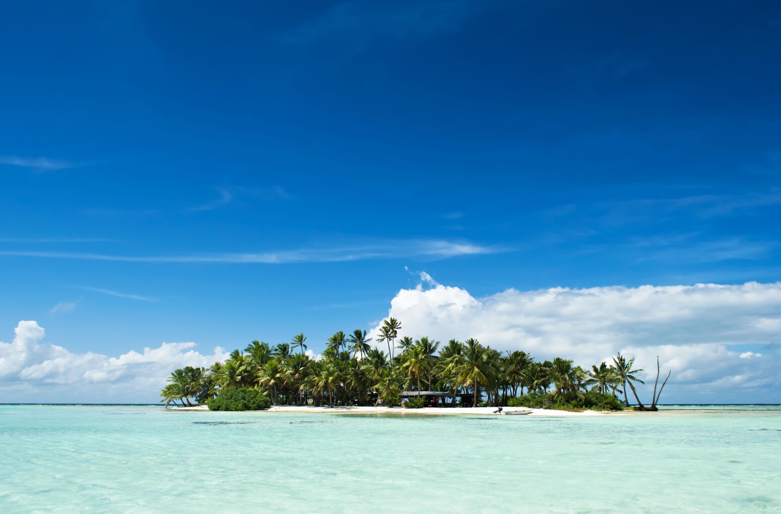 Uninhabited or desert island in the Blue Lagoon inside Rangiroa atoll, an island near Tahiti in French Polynesia.