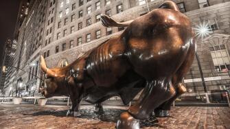 Wall street bull at night
