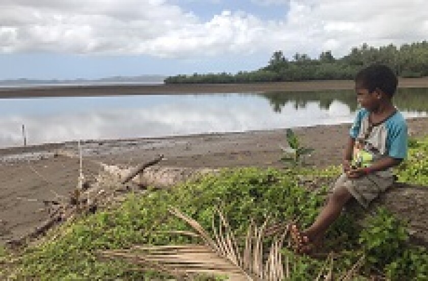 Fiji boy in village climate change from PA 230x150