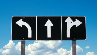 Road or traffic sign with arrows going different directions