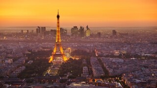 Paris skyline at sunset with the Eiffel Tower and La Defense, Paris, France, Europe
