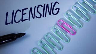 Word writing text Licensing. Business concept for Grant a license Legally permit the use of something Allow activity written on Plain Blue background Paper Clips and Marker next to it.