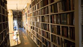 small library tight hallway bookshelves