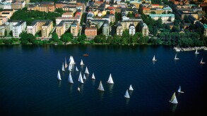 Aerial shot of Sailboat Day in Stockholm on Riddarfjarden with Kungsholmen suburb of Stockholm beyond white sails