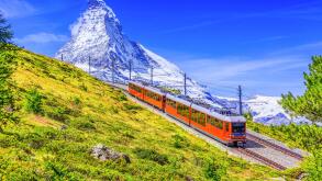 Zermatt, Switzerland. Gornergrat tourist train with Matterhorn mountain in the background. Valais region.