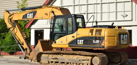 Parked Caterpillar construction equipment (Digger / Excavator).