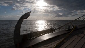 Tyrrhenian sea anchor on boat in backlight back light sunshine seascape seaside boats sea marine sail sailing cloudy sky weather
