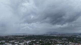 Clouds cover Kingston, Jamaica, ahead of the forecast arrival of Hurricane Melissa on Sunday, Oct. 26, 2025. (AP Photo/Matias Delacroix)