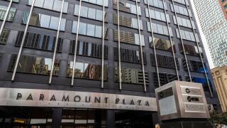 New York City, USA - August 3, 2018: Facade of the Paramount Plaza (Uris Building or 1633 Broadway) with people around on Broadway in Midtown Manhatta