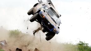 Driving their Volkswagen, Giniel De Villiers of South-Africa and his German co-driver Dirk von Zitzewitz are airborne after they have encountered a series of dirt road bumps hiding behind a steep road section, resulting in a multiple roll-over during the 