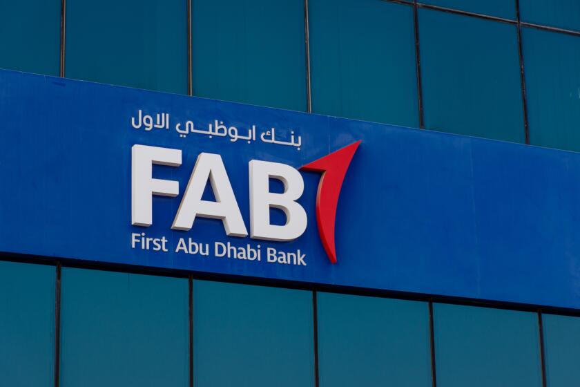 "Ras al Khaimah, Ras al Khaimah/United Arab Emirates - 10/11/2019: "First Abu Dhabi (FAB) Bank blue logo close-up on a blue sky sunny day. "