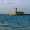 Normanton Church stands by the edge of Rutland Water a reservoir of Anglian Water Rutland England. Image shot 2003. Exact date unknown.