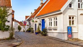 Street with white houses in the old part of Stavanger, Norway.