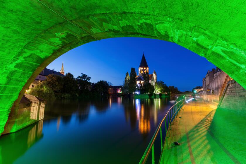 Temple Neuf and illuminated bridge in Metz, France