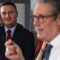 Britain's Health Secretary Wes Streeting, left, watches as Britain's Prime Minister Keir Starmer gives a speech on reducing NHS wait times as he visits a healthcare provider in Surrey, England, Monday, Jan. 6, 2025, (Leon Neal/Pool Photo via AP)