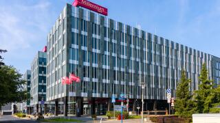 Warsaw, Poland - July 25, 2021: Millennium Park plaza known as Harmony Office Center at Bialy Kamien and Zaryna street in Mokotow residential district