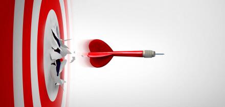 Setting New Goals and Breaking through or overcoming challenges as a dart representing entrepreneurship and unlimited business success focus blasting