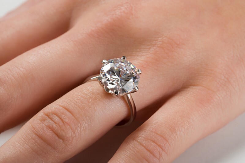 A woman wearing an engagement ring