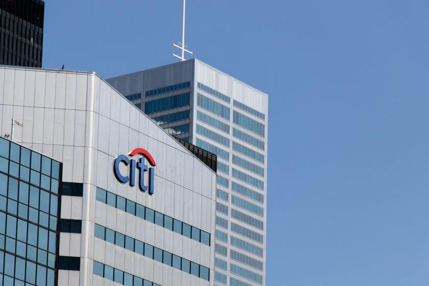 The Citi bank, Citigroup logo atop of an office building in downtown Toronto, seen on a clear and blue sky day.