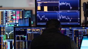 A trader works on the floor of the New York Stock Exchange, Tuesday, March 11, 2025. (AP Photo/Richard Drew)