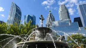 Berczy Park Dog Fountain and surrounding urban skyline cityscape of downtown Toronto, Ontario, Canada.