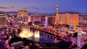 City skyline at night with Bellagio Hotel water fountains, Las Vegas, Nevada, USA