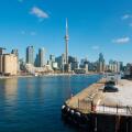 The Toronto skyline from the Billy Bishop Toronto City Airport overlooking the parking lot. Toronto, Ontario, Canada.