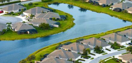 American gated community houses in rural US suburbs. View from above of large residential homes in small town in southwest Florida.
