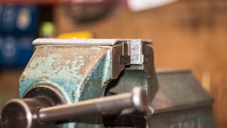 Vice on a workbench in a metal and wood working workshop