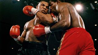 Mike Tyson vs. Frank Bruno for the WBA, WBC, IBF and lineal heavyweight championships. Tyson defeated Bruno by way of TKO in round five.25th February 1989