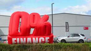 advertisement of zero percent finance available outside car dealership knaresborough yorkshire united kingdom