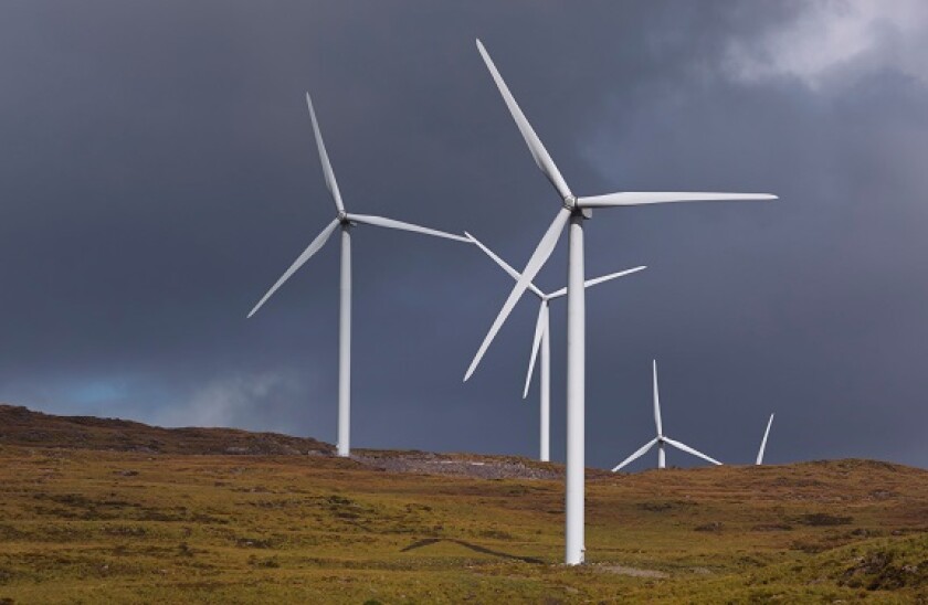 Windmills producing alternative energy near Kenmare, County Kerry, Republic of Ireland.