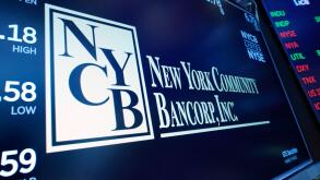 The logo for New York Community Bancorp is displayed above a trading post on the floor of the New York Stock Exchange, Wednesday, Jan. 31, 2024. New York Community Bancorp Inc. on Wednesday reported a loss of $252 million in its fourth quarter. (AP Photo/