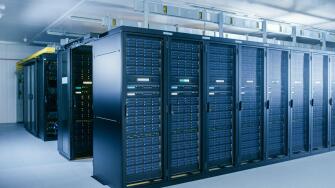 Shot of Data Center With Multiple Rows of Fully Operational Server Racks. Modern Telecommunications, Cloud Computing, Artificial Intelligence