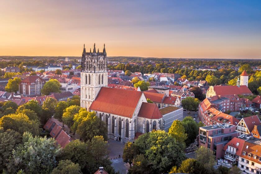 Aerial sunset view of the Uberwasserkirche church in Munster, Germany