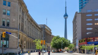 Toronto, Canada. View down Front Street towards the CN Tower with the Dominion Public Building to the left, Toronto, Ontario, Canada