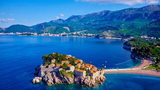 Montenegro, Adriatic coast, Bay of Budva, Island of Sveti Stefan (St. Stephen), once a fishing village, now a luxury hotel compl