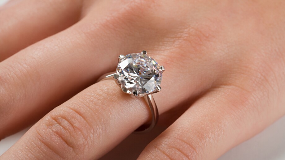 A woman wearing an engagement ring