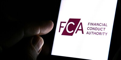 FCA Financial Conduct Authority logo on the smartphone and finge