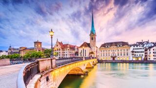 Zurich, Switzerland. View of the historic city center with famous Fraumunster Church, on the Limmat river.