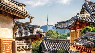 Bukchon Hanok village in Seoul with view on traditional houses roofs and tower in the distance in Seoul South Korea
