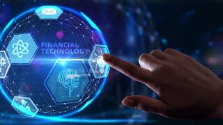Fintech -financial technology concept.Young businessman  select the icon Fintech on the virtual display.