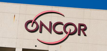 A logo sign outside of a facility occupied by Oncor Electric Delivery in Dallas, Texas on September 13, 2015.
