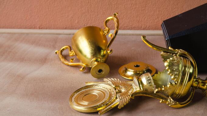 High Angle View Of Broken Trophy On Table