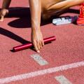 Female athlete ready to start the relay race
