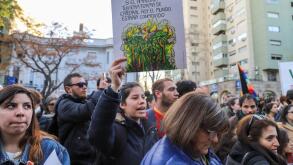 Montevideo, Uruguay. 23rd Aug, 2019. A protester holds a placard in front of the Brazilian embassy in Montevideo during the demonstration against fires in the Amazon. Credit: SOPA Images Limited/Alamy Live News
