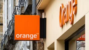 Orange shop sign in Bayonne, France